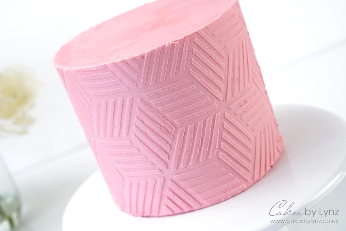 stencil on a buttercream cake