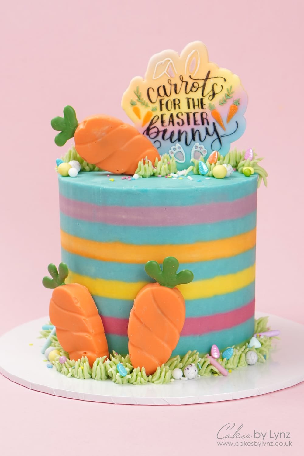 Striped Easter themed cake tutorial with carrot cakesicles