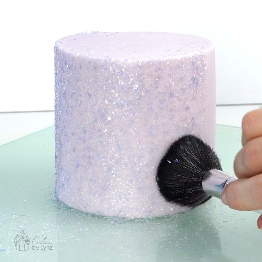 applying edible glitter to your cakes
