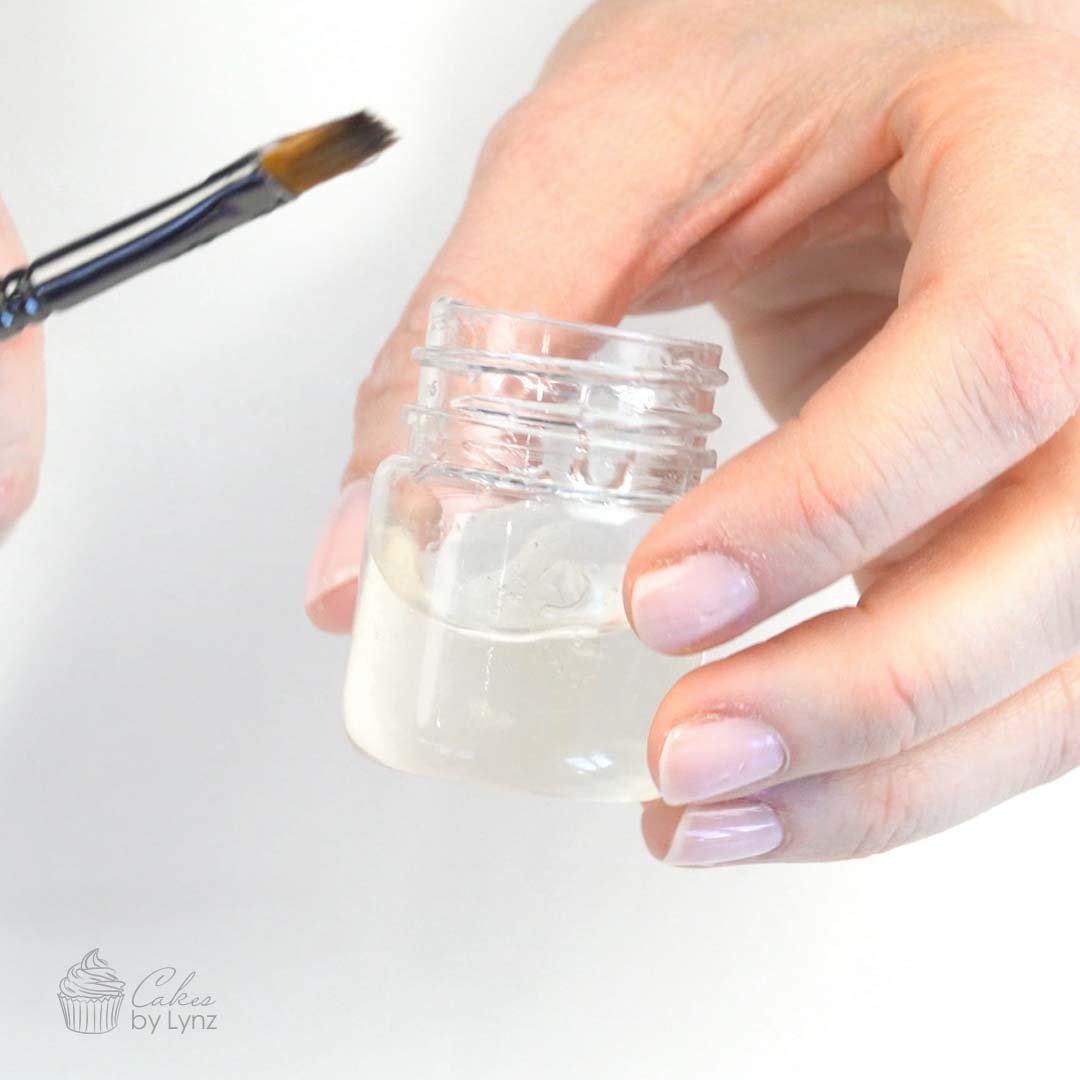 apply glitter to your cake with edible glue