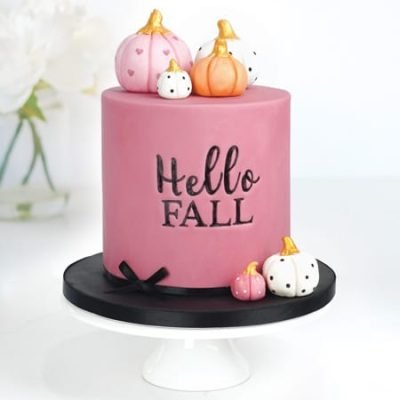 fall inspired cake with personalised lettering and fondant pumpkin cake toppers